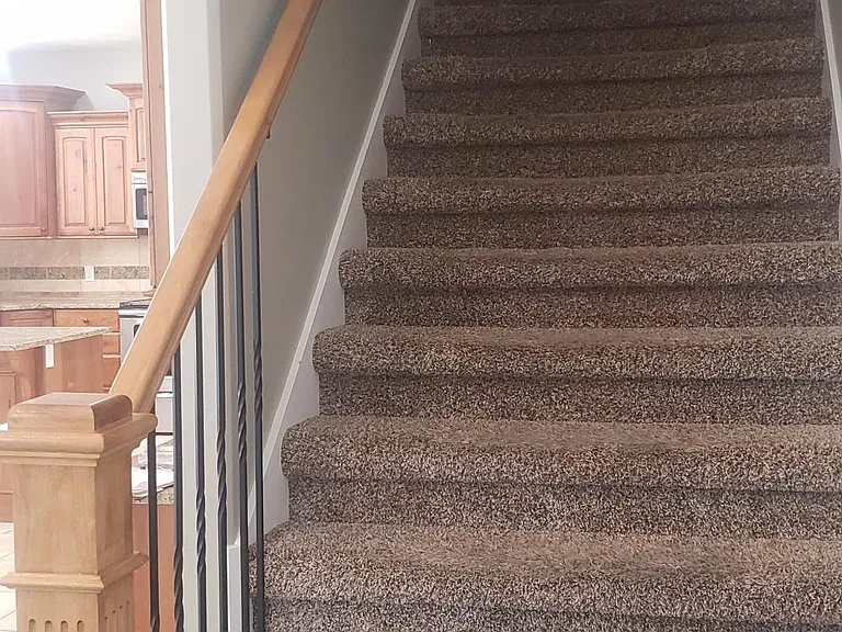 Inviting stairway to upper bedrooms and laundry.