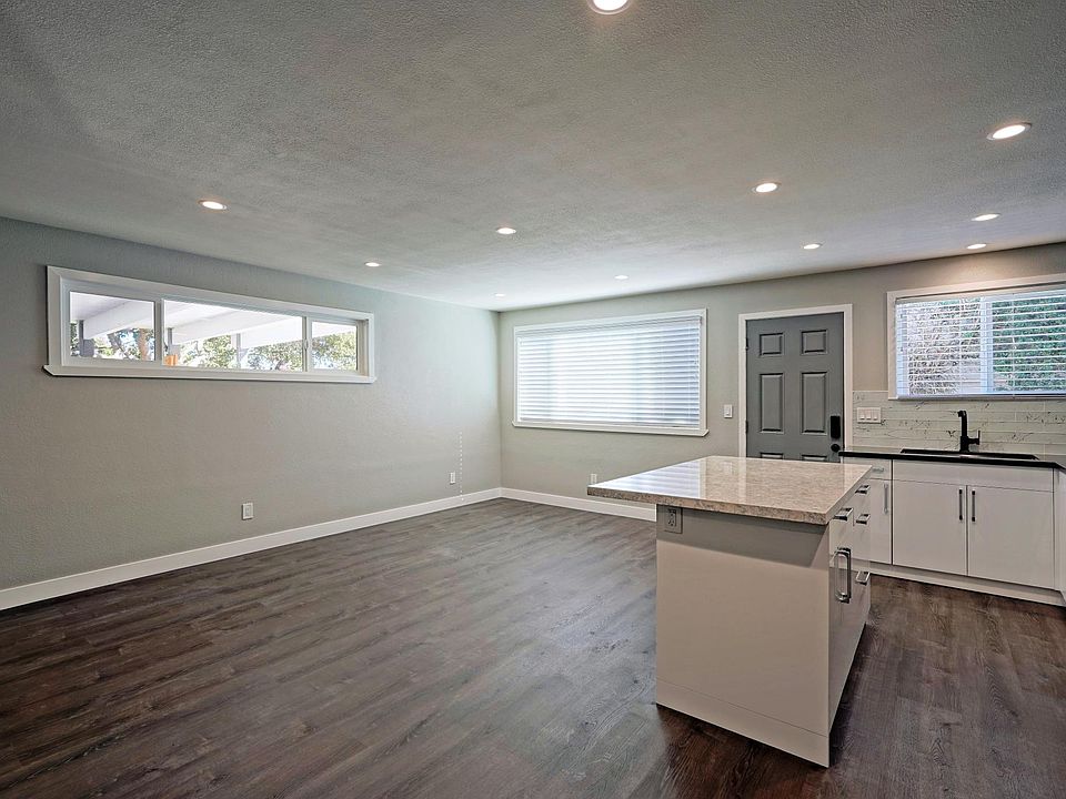 Kitchen opens to spacious living room space.