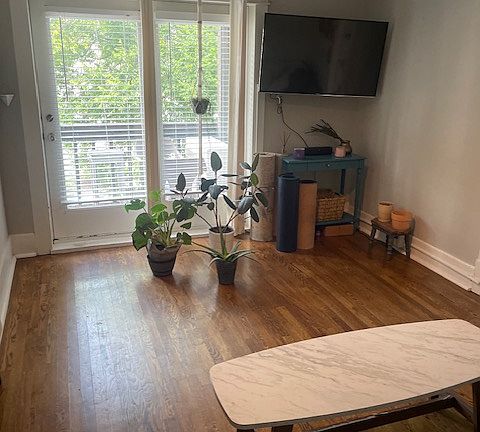 Living room view looking out to the balcony.