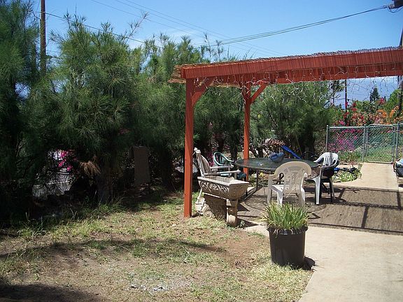 Pergola attached to basement studio