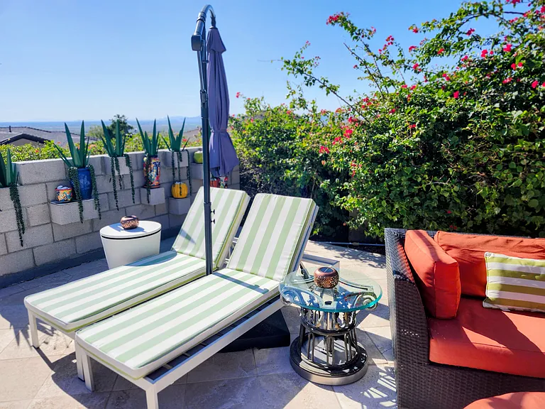 Private sunning spot with pool and mountain vistas