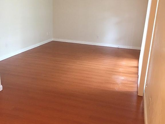 Living room has large picture window for plenty of light.