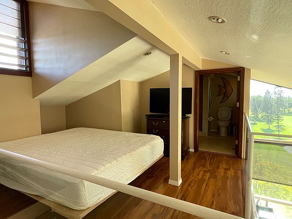 Loft bedroom with ensuite bathroom