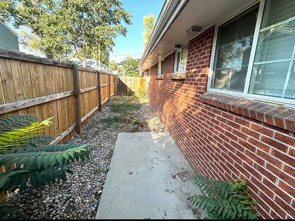 Explore your serene outdoor escape with this charming side walkway.