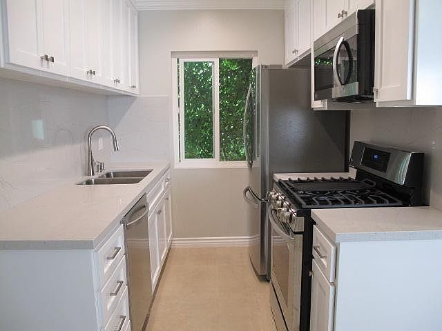 Kitchen with all new cabinets, counters, back splash, and LG stainless appliances.