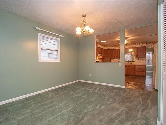 View from living room into the dining and kitchen areas