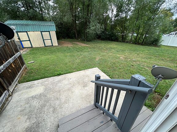 Back deck and yard. Storage building