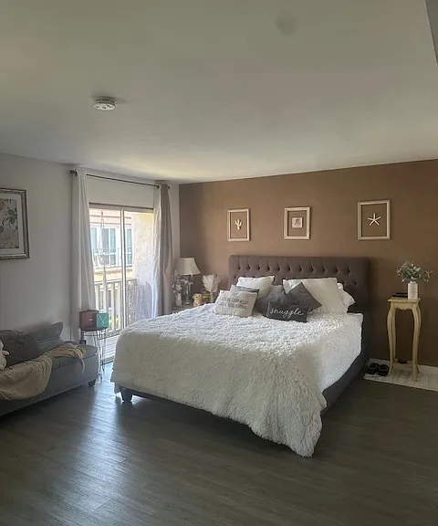 Huge Master Bedroom with Balcony. California King Bed for Reference.