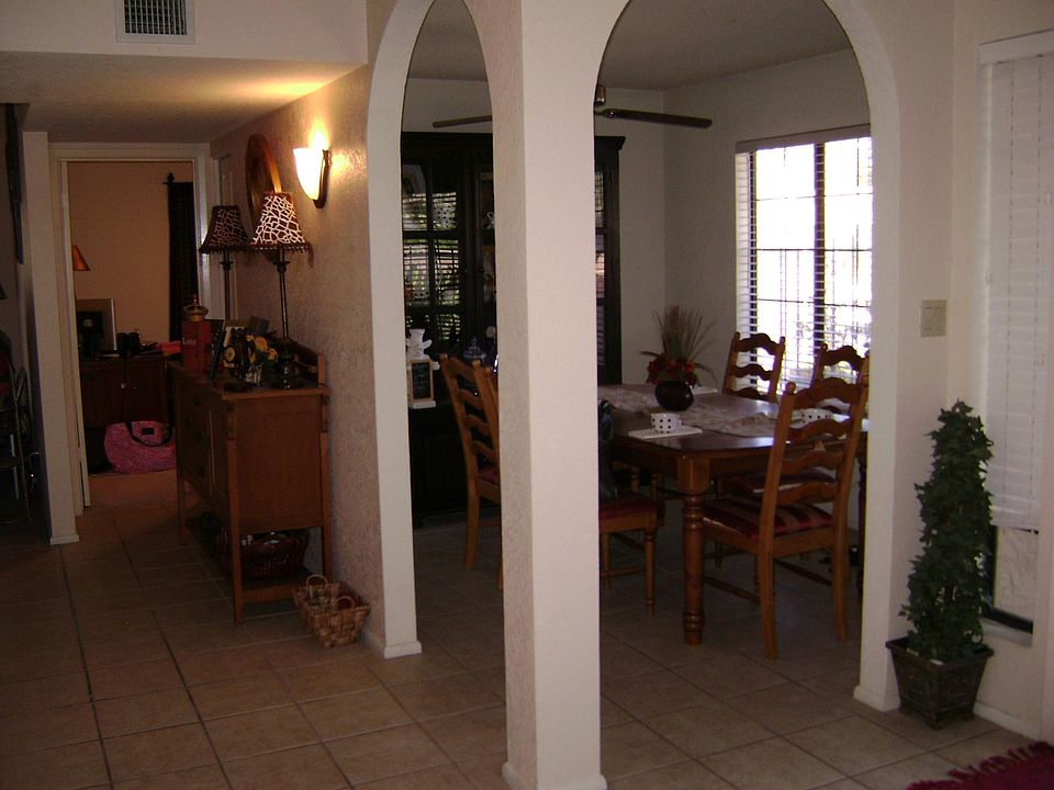 Front door is to the Right. Looking from Kitchen into office or dining rm into 1st bedroom.