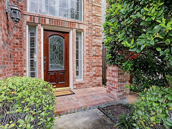 Entrance with mellow bricks lead guests to an inviting retreat!
