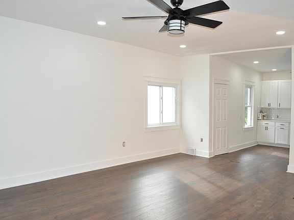 Open concept living area view into kitchen.