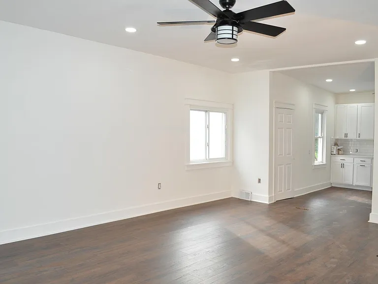 Open concept living area view into dining/kitchen area.