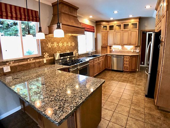 Large bar-top peninsula for eating or entertaining.