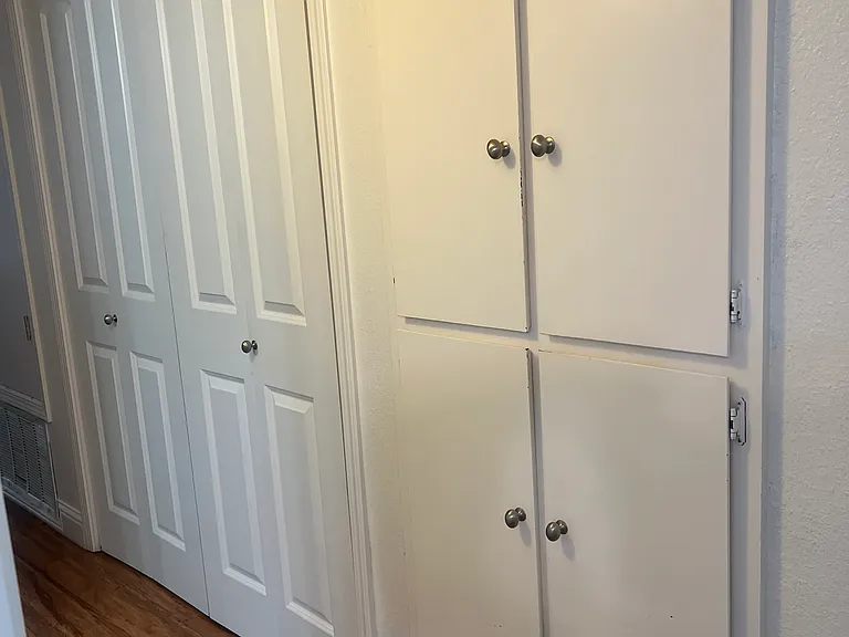 Hallway laundry closet and linen closet