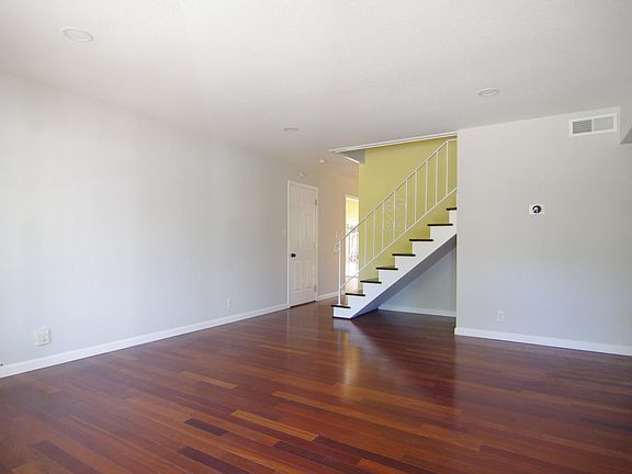 Formal Living Room with stairs to upstairs bedrooms.