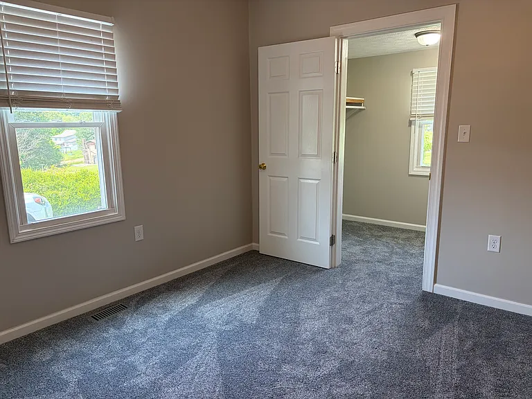 Bedroom 1 with closet and additional oversized multi-purpose space
