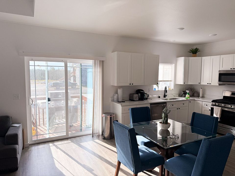 Sliding door from the living area out to a patio that will walk out into your own fenced in yard.