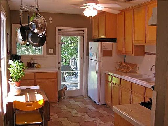 Kitchen has been updated with maple cabinets and gas stove. Refrigerator provided.