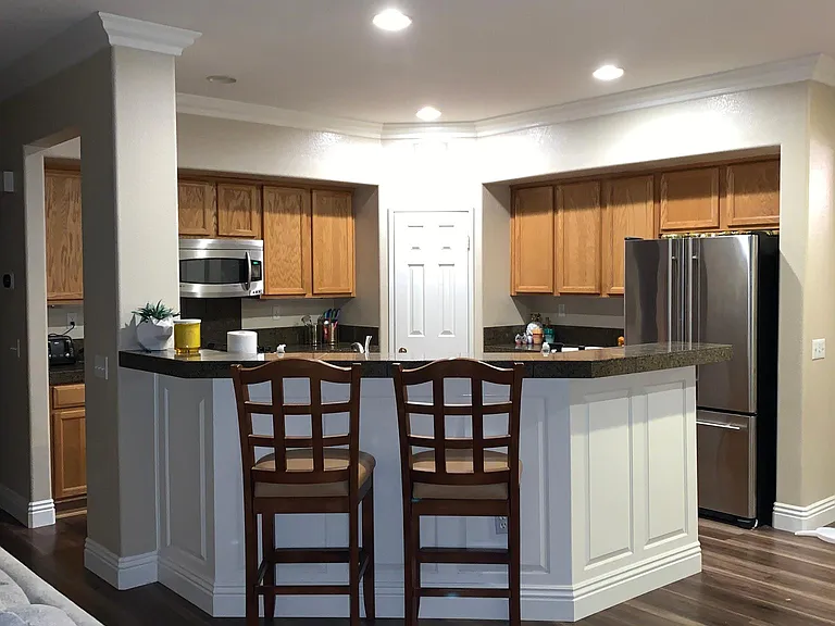Open floor plan connecting kitchen to family room