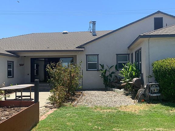 Beautiful raised garden beds and flowers off back porch