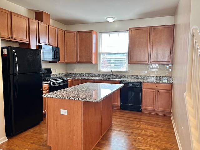 Kitchen with island seating and extra cabinets