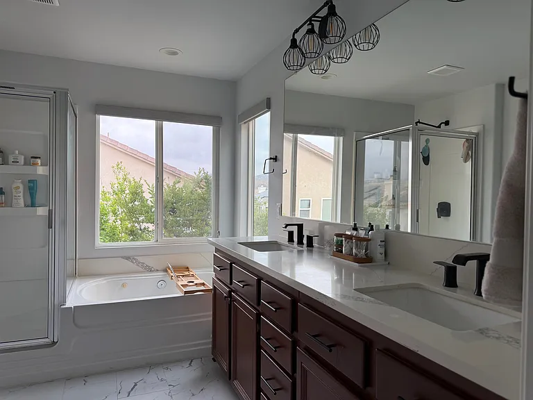 Updated Calacatta marble-styled counters and flooring