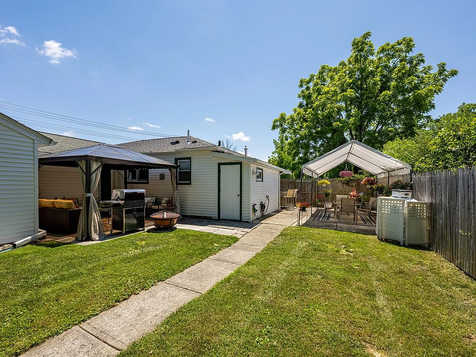 Private backyard with pergola and tent