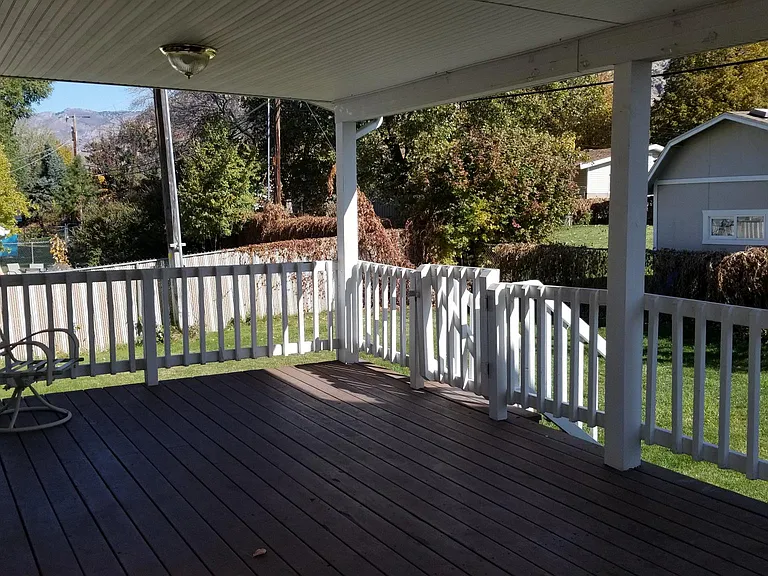 Large back covered deck off kitchen area.