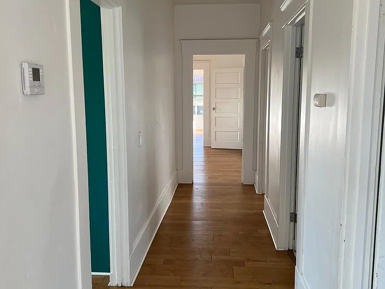 Hall way to all bedrooms, kitchen, bathroom and dining room