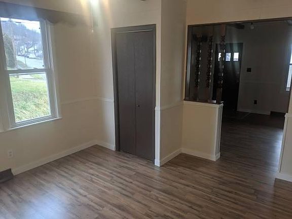 The dining room offers new wood flooring and has been freshly painted.