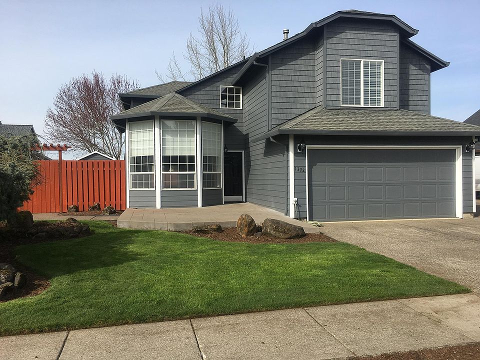 Canby Home with concrete stamped deck and concrete walkway t