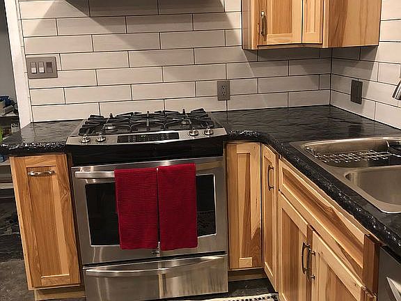 Kitchen with concrete tops