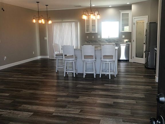 Entry into home with a view of the kitchen.