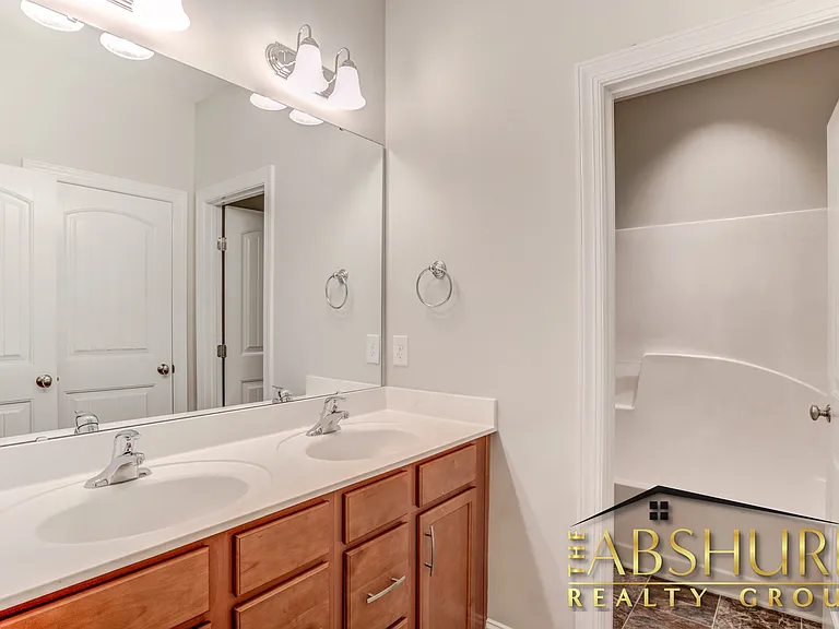 2nd Floor Hall bathroom with dual vanity cultured marble countertops, shower/ tub combo
