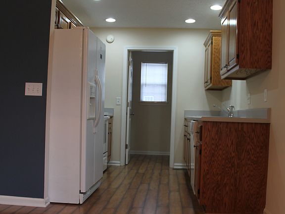 Galley kitchen leads to laundry room & garage.