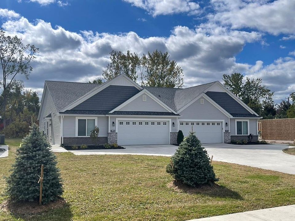 New, great curb appeal extra on-site parking, and 1/2 acre back into trees and stream