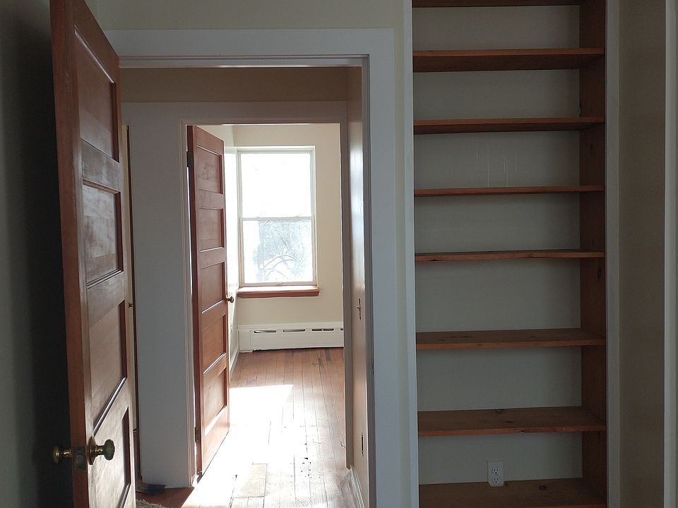 View from one corner bedroom into the other; shelf. (Closet is to the right)