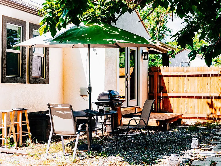 Outdoor dining area with BBQ.