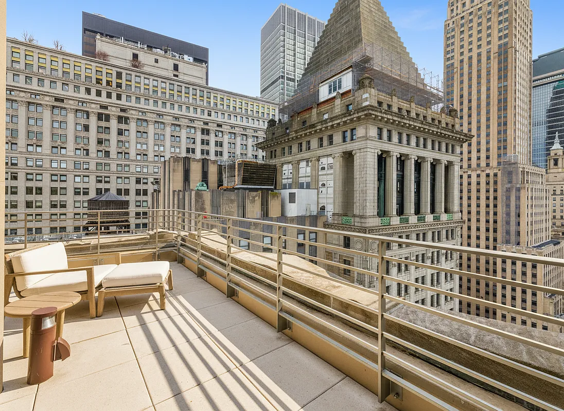 Great room with floor-to-ceiling windows and skyline views