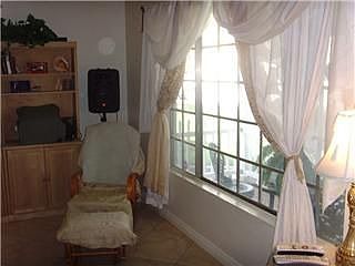 Large living room,charming picture window,tile floor