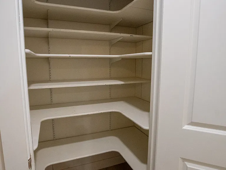Large pantry has plenty of room for your food and/or personal items.