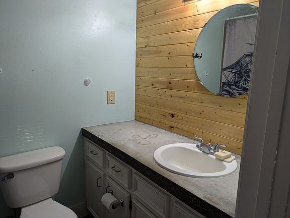 ensuite bath with concrete countertop