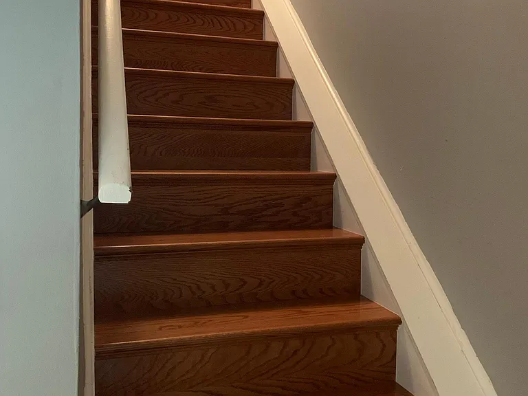 Hardwood steps to the second floor