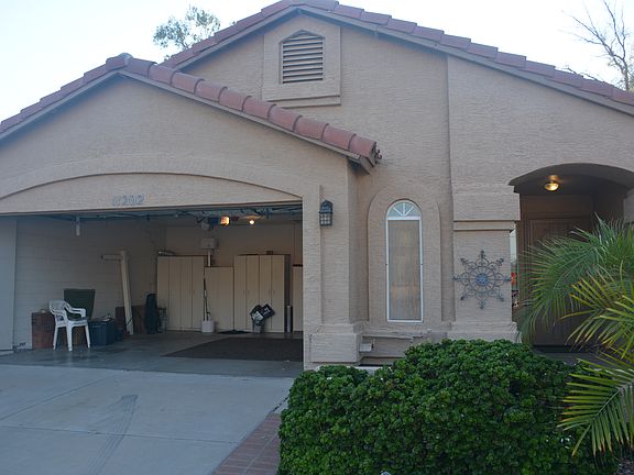 Front side with garage open