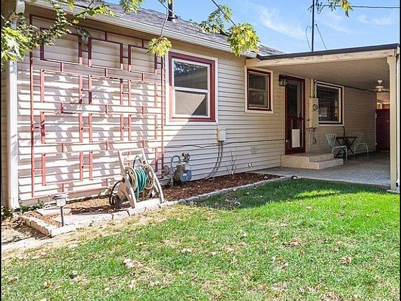 Fenced in back yard and covered patio