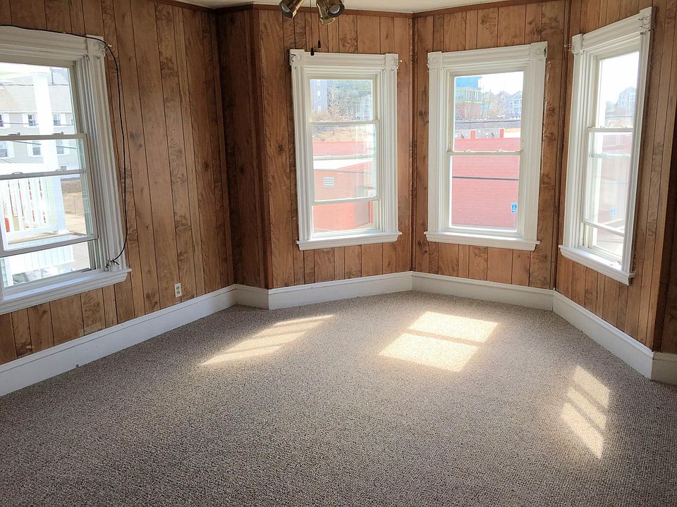 Living room with water view and has new carpeting.