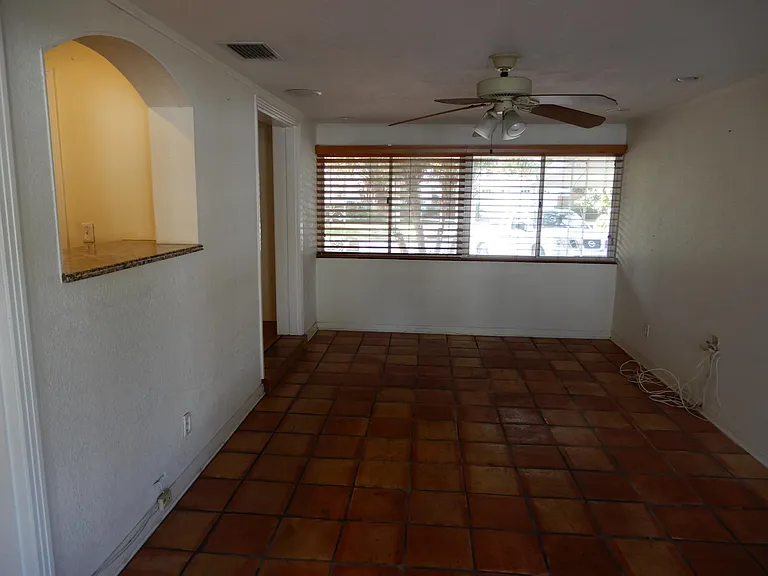 West facing view of Large great room with entertainment center and recessed ceiling speakers setup.