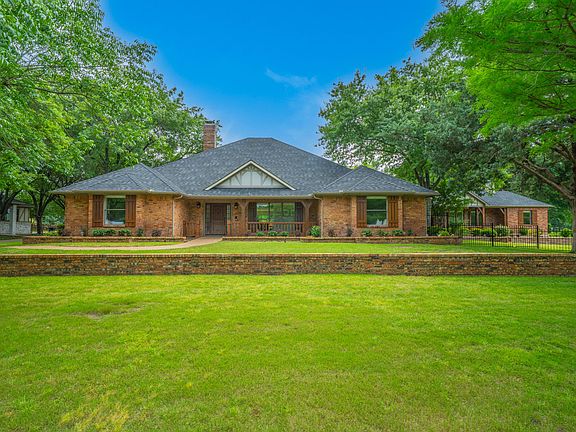Elegant Brick Estate with Massive Lawn & Professional Landscaping