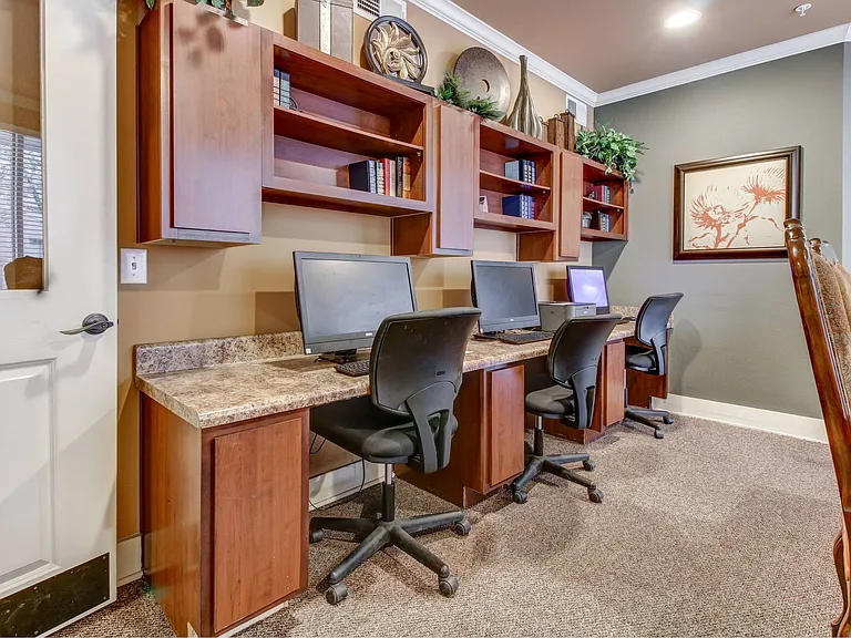 Business Center with three computers and working desk