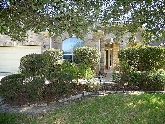 Lush landscaping guides you to the front porch of this wonderful home.